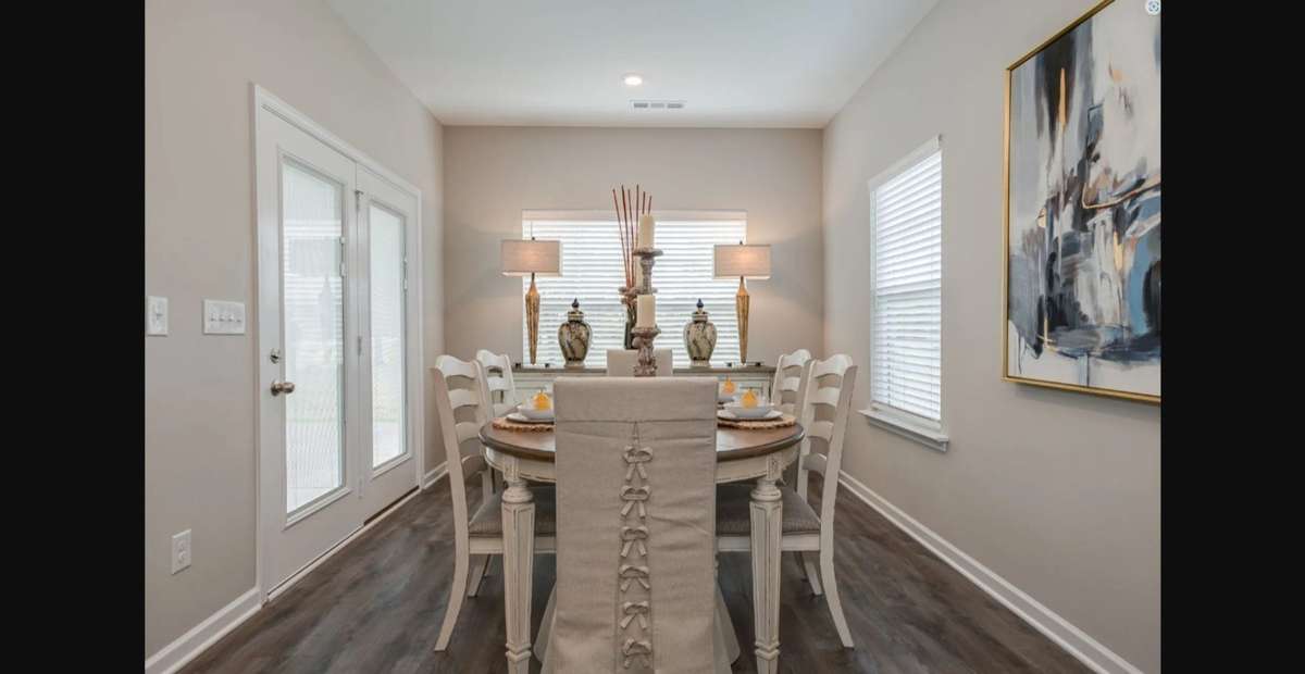 Stock photo of breakfast area which leads out to nice covered back porch