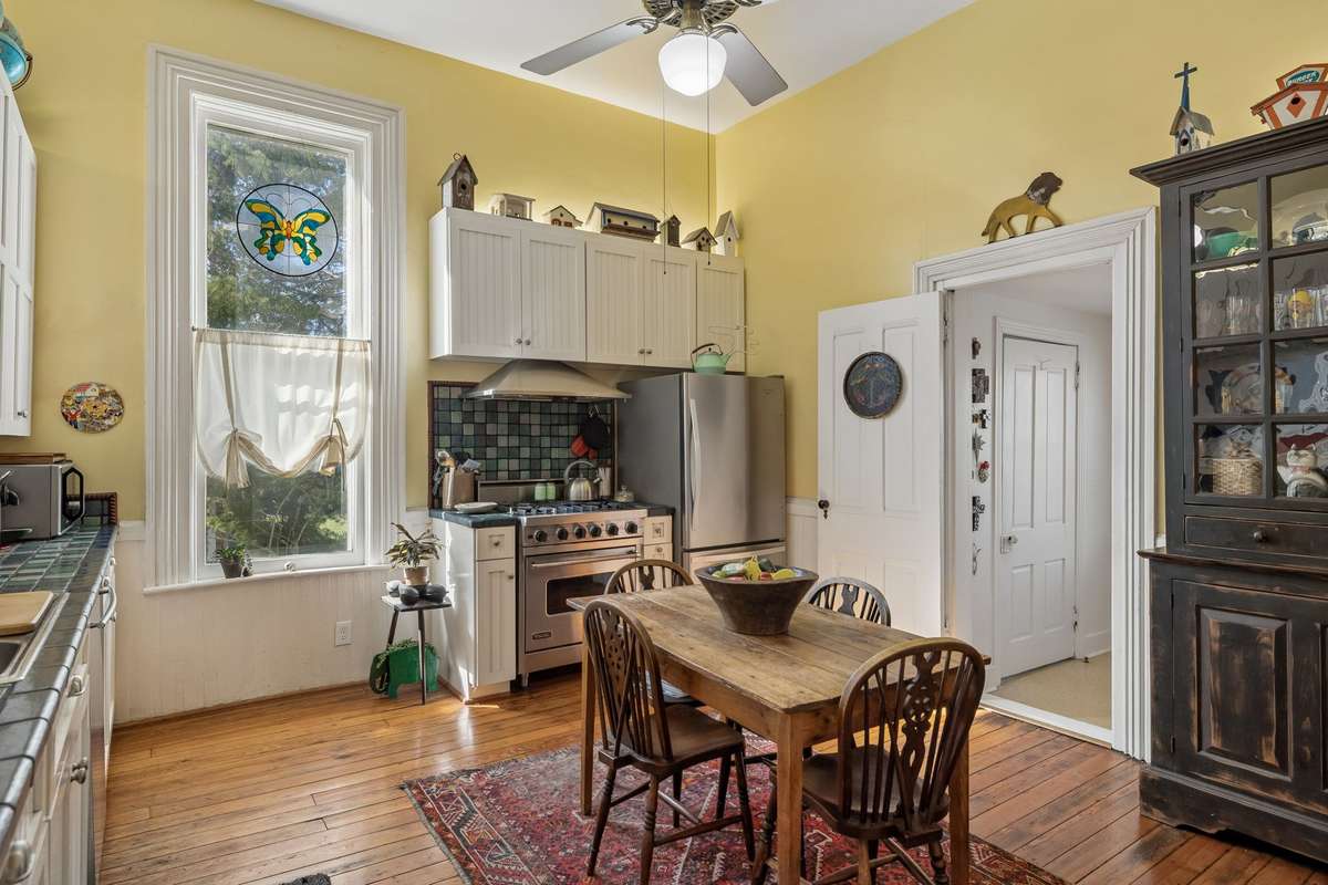 The coolest kitchen in the neighborhood. The door to the right leads to a small bedroom with a closet that is now used as a kitchen pantry.