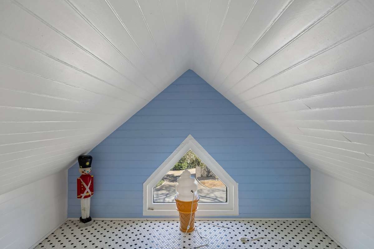 The homeowners are known for entertaining the neighborhood with various illuminated items in this secret room on the second floor. Ice cream cone in the summer and toy soldier at Christmas