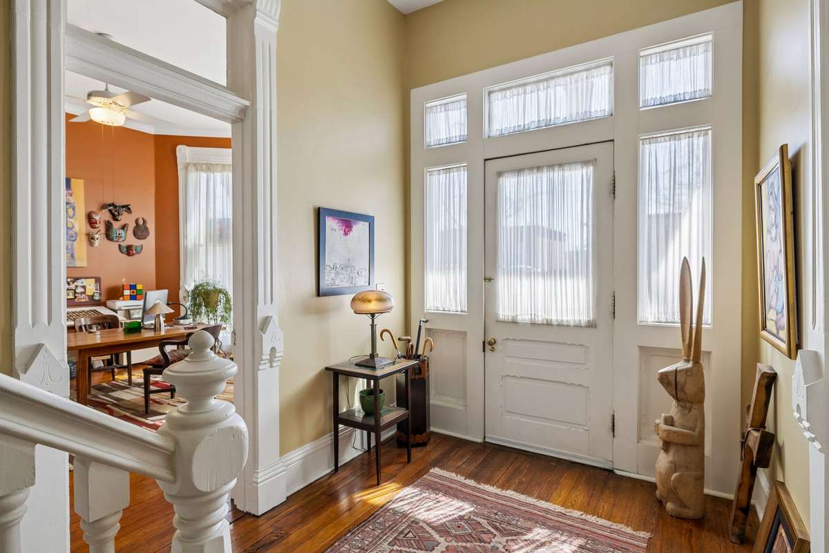 The beautiful dappled light shining through the front entrance of this historic home, known as The Belair House