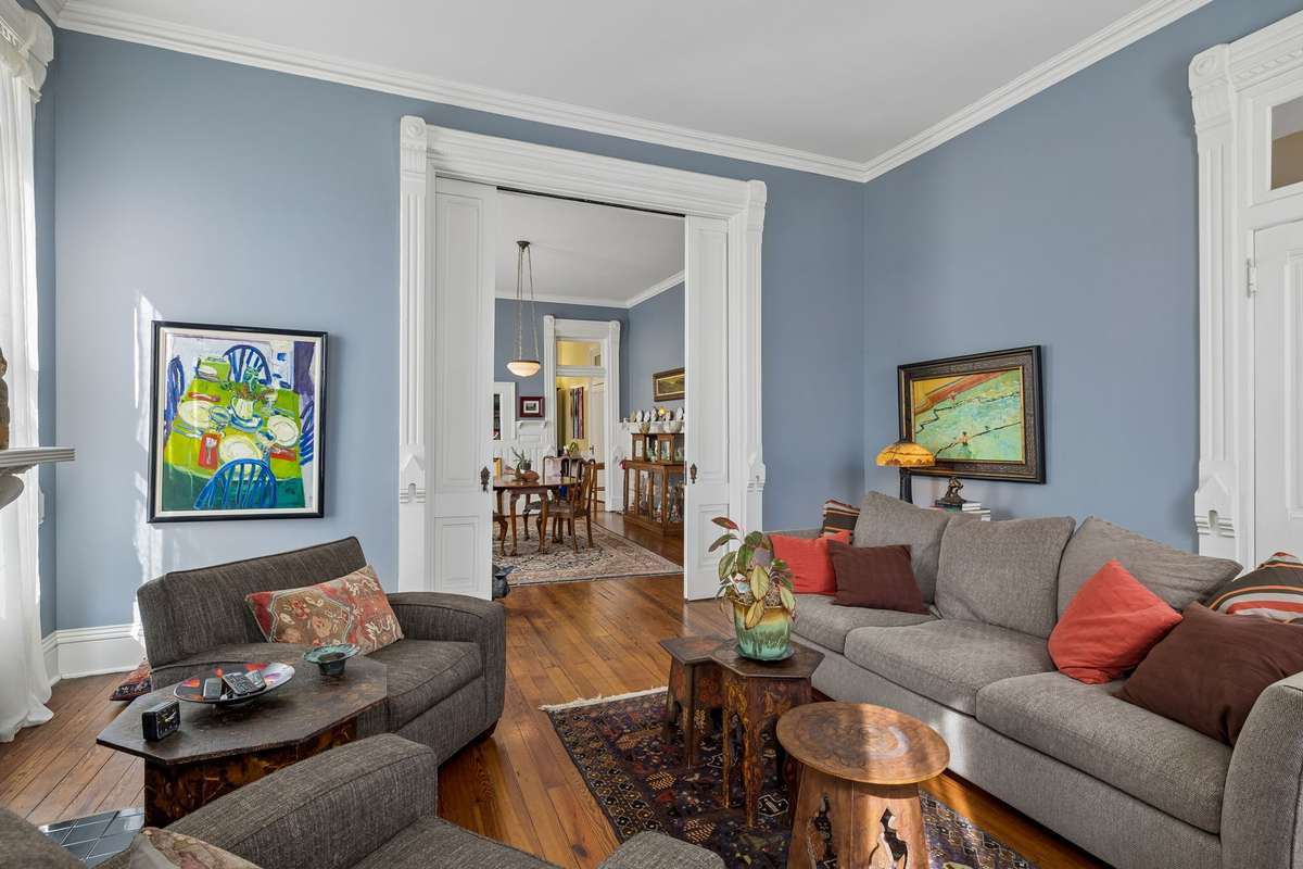 The Parlor/Living room leads to the spacious dining room