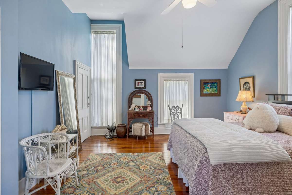 Light from the large windows, floods this beautiful bedroom on the second floor