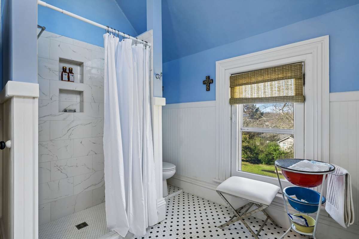The second floor full bath with shower and tub