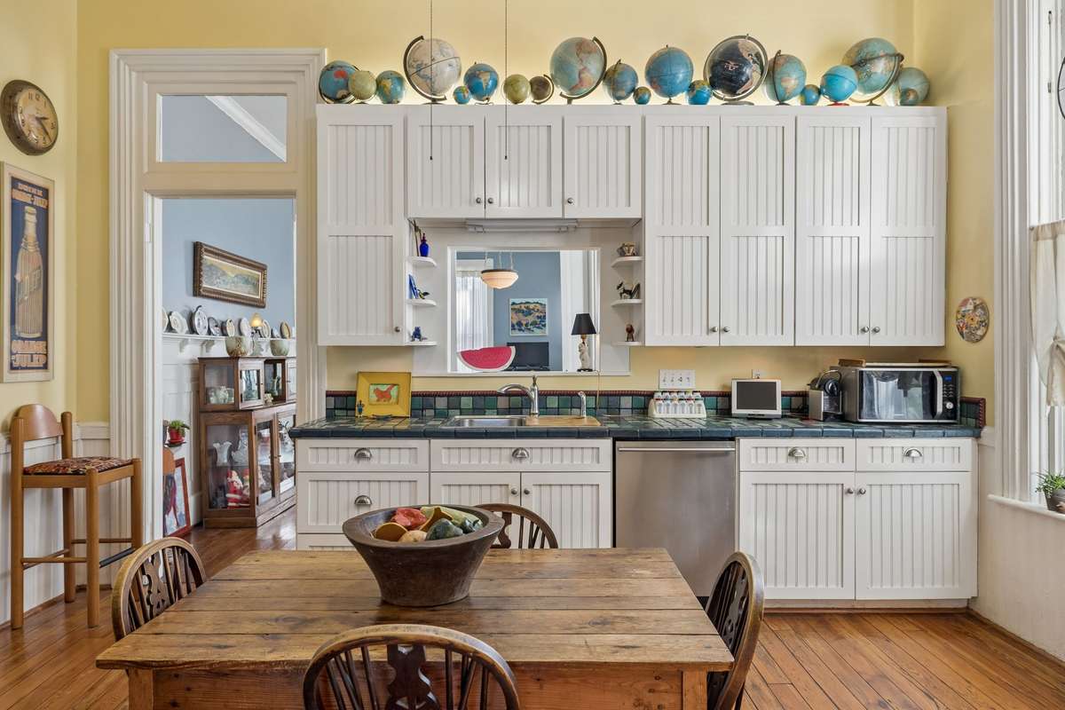 This kitchen has plenty of storage and charm with a pass-through to the dining room.