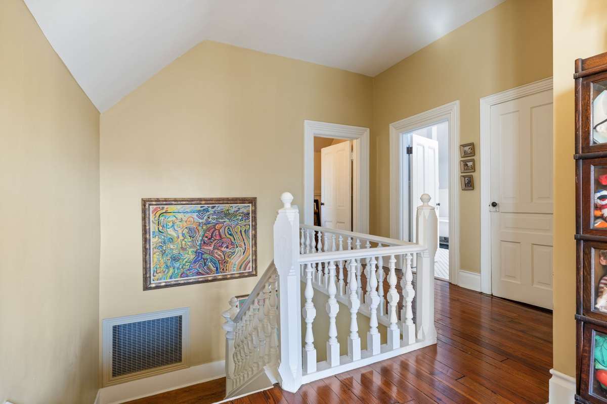 The expansive second-floor offers several flexible spaces for 3-4 bedrooms and a full bath. The fourth bedroom is currently being used as an art studio.