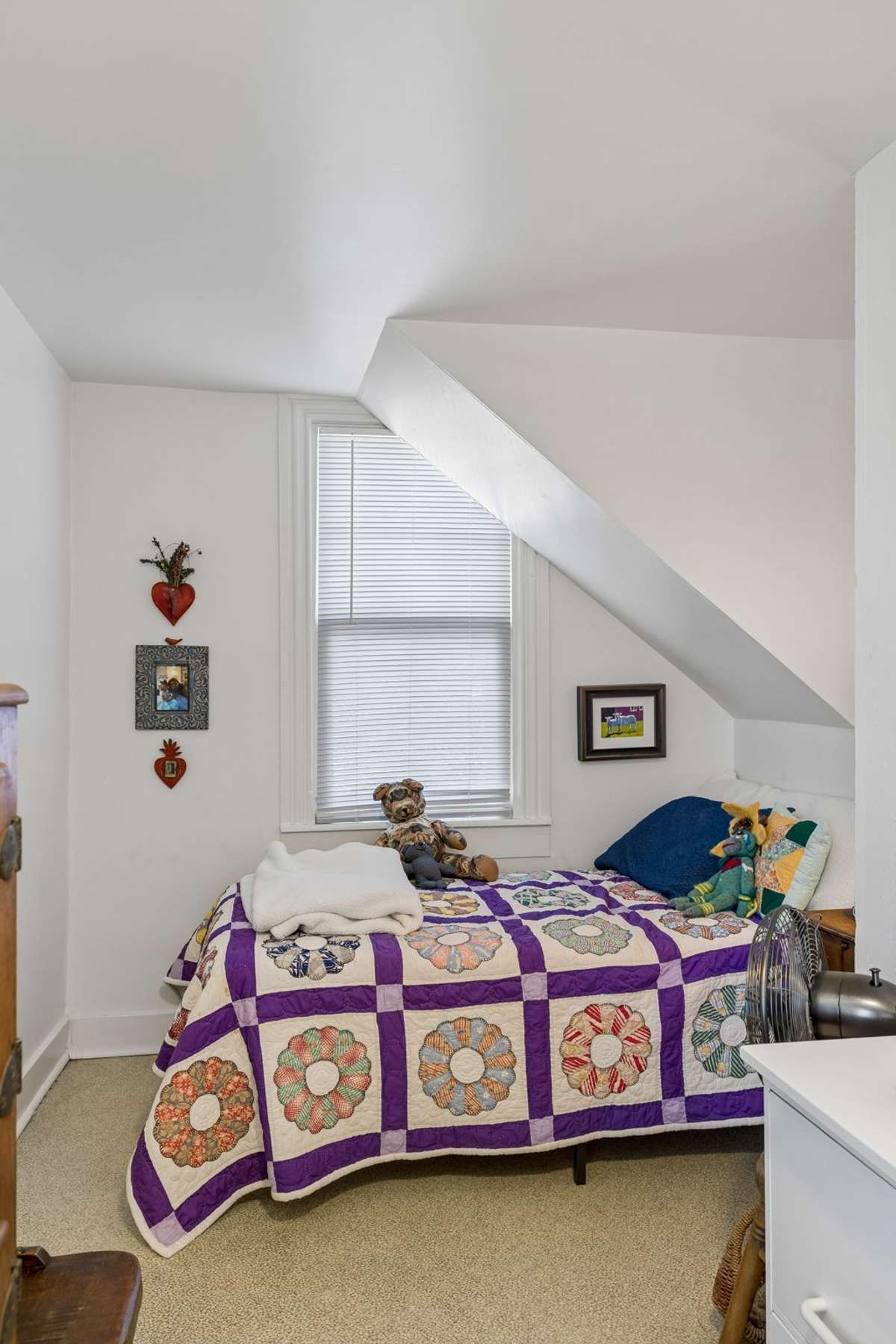 An adorable bedroom perfect for a nursery, a child's room, or live-in help. It has great light and lots of character.