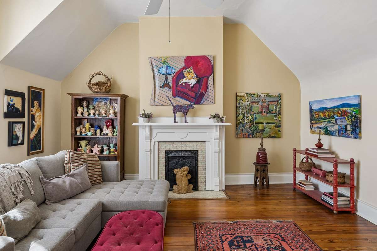 Another western-facing bedroom/ living area with a beautiful fireplace surround