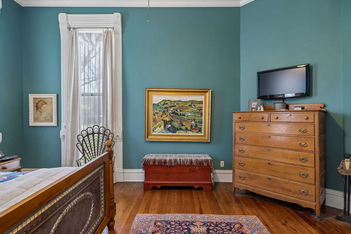 Beautiful original floors and intricate, detailed casements surrounding the 10' windows