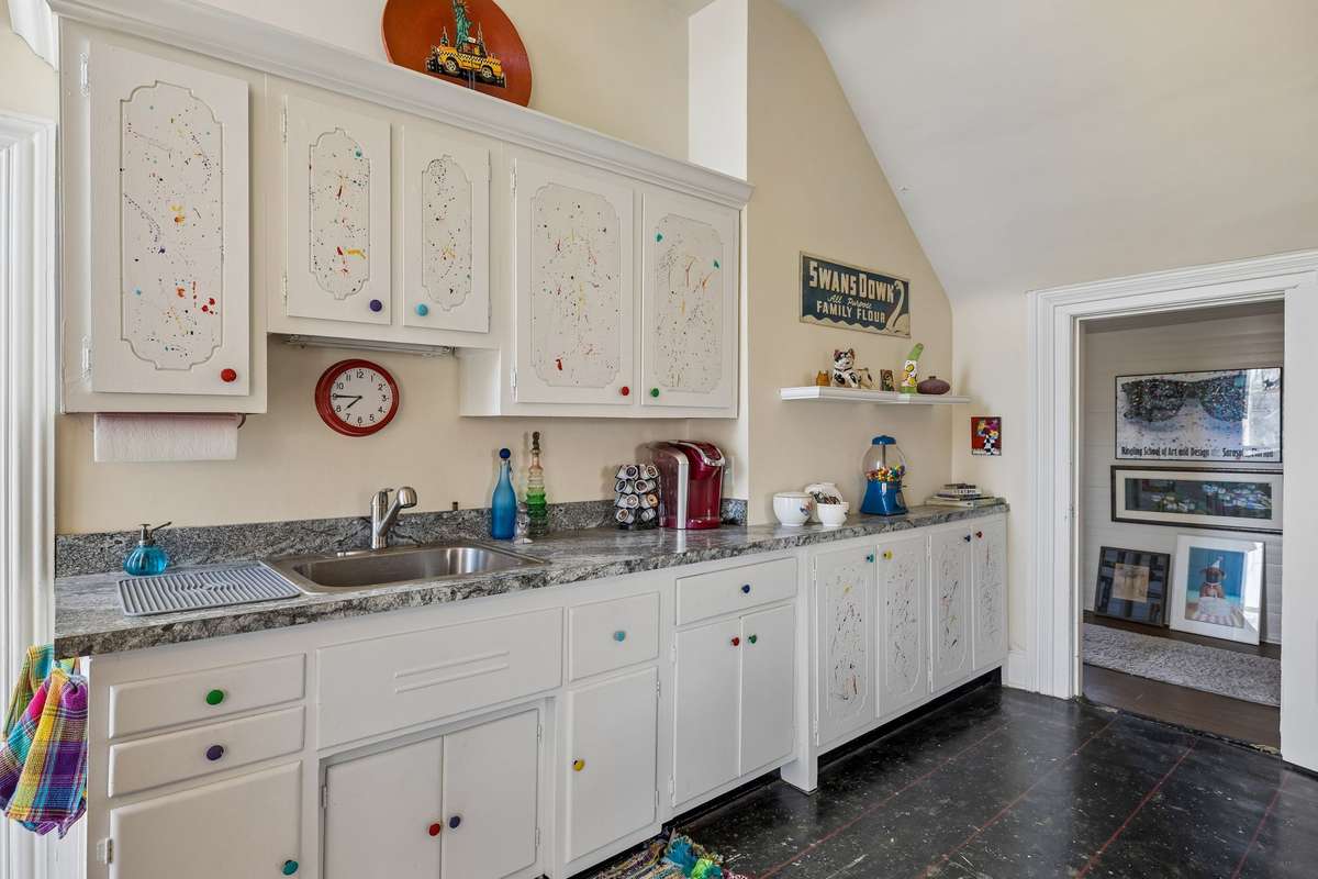 This area in the art studio on the second floor would also make a cool wet bar,  but could easily serve, as it once did, as a bedroom, an additional kitchen, or playroom