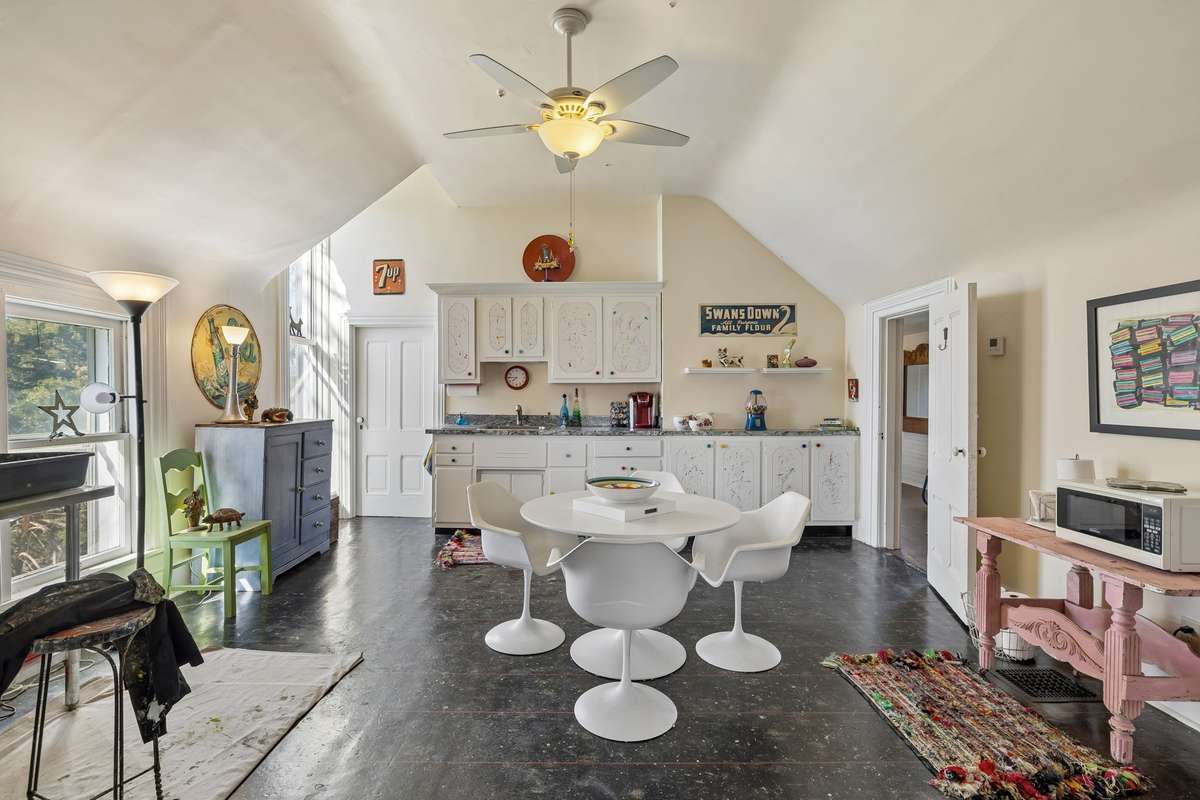 The large art studio was once a full kitchen and dining area, and could be used as another bedroom or as a play area