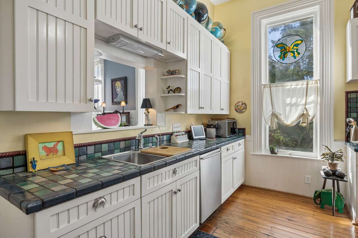 The fabulous kitchen countertops are just gorgeous. They are Zellige tiles!