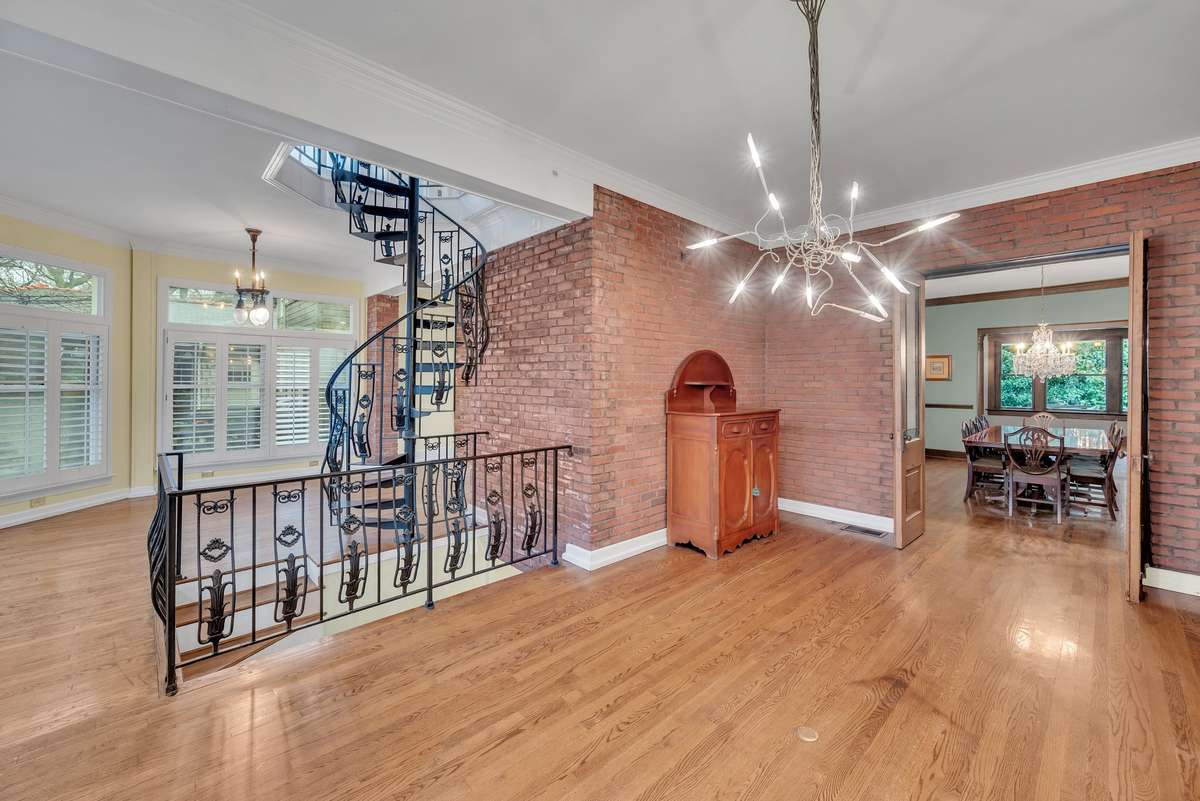 Staircases lead you up to 2nd floor Sunroom and down to the lower level rooms