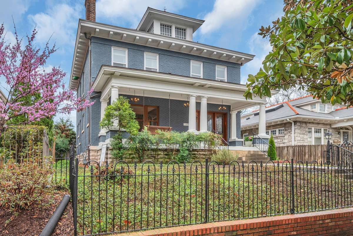 All Brick Home w Slate Roof capped with metal finials