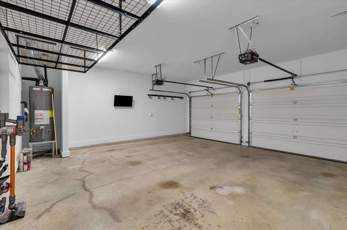 Oversized 2 car garage with ceiling storage & utility racks