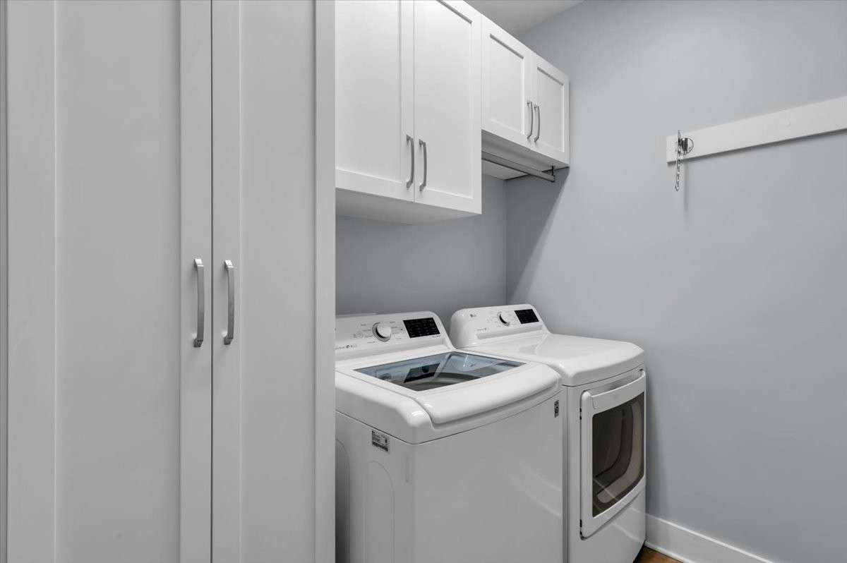 First floor laundry room with custom cabinetry