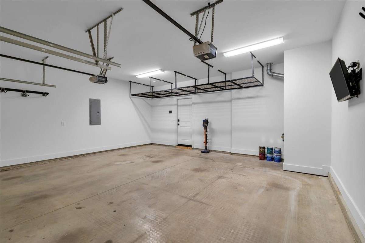 Oversized 2 car garage with ceiling storage & utility racks