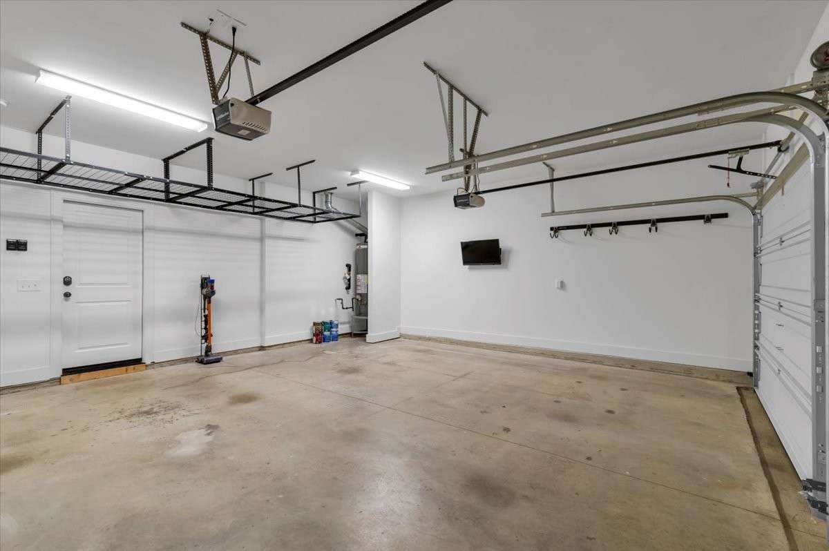 Oversized 2 car garage with ceiling storage & utility racks