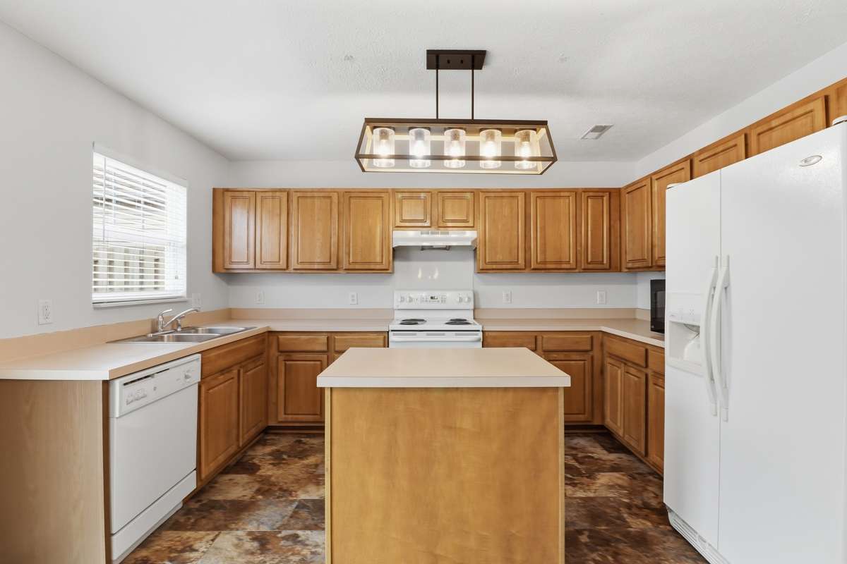 Lots of cabinets and counter top space in this home.