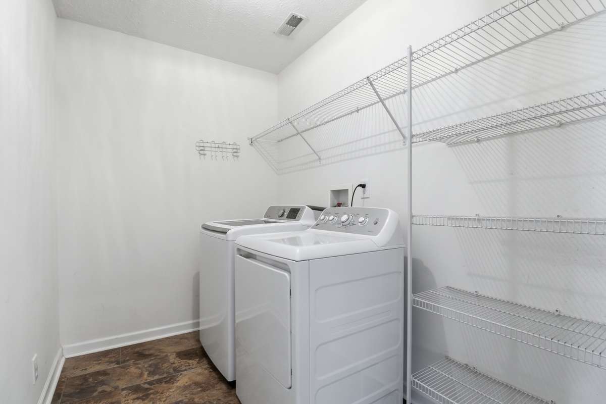 The Utility Room is nice size with washer and dryer remaining. Shelves already in place for the new buyer