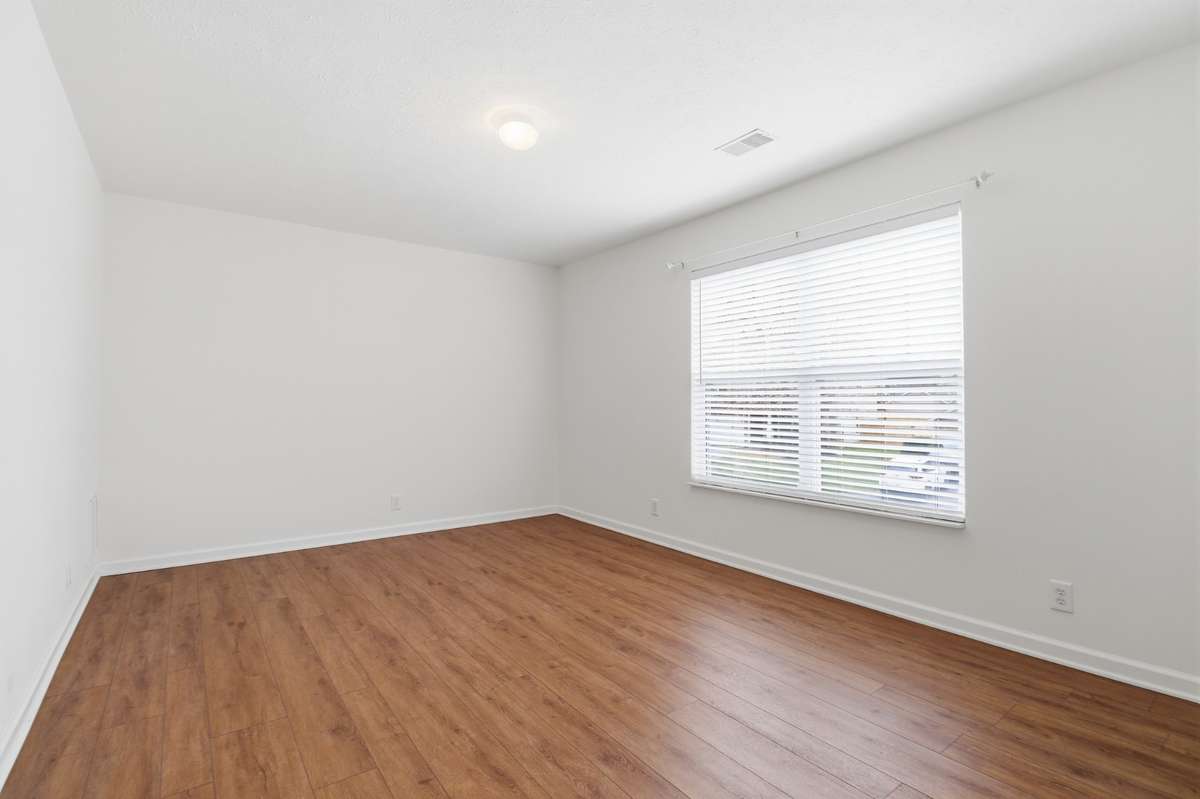 One of the Guest Bedrooms with LVP flooring and is a very nice size