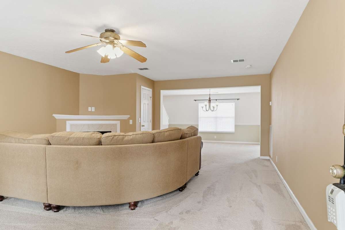 The Den is huge with fireplace, gas logs,and  ceiling fan
