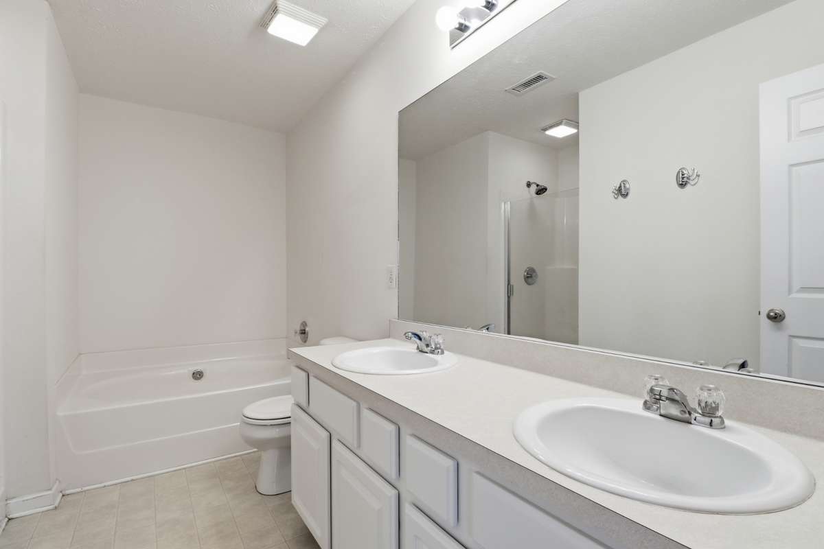The Primary bath features a large soaker tub and separate shower. Plus Double Vanities