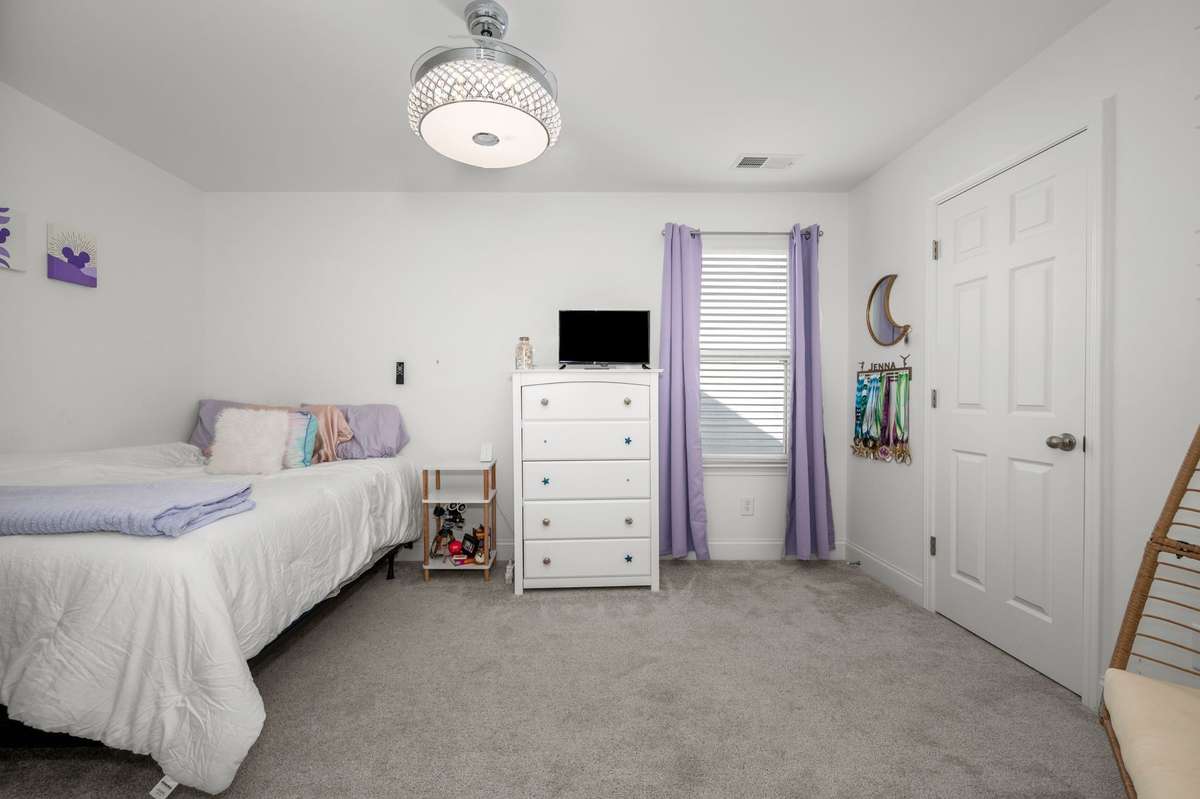 Guest bedroom #1 upstairs with walk-in closet!