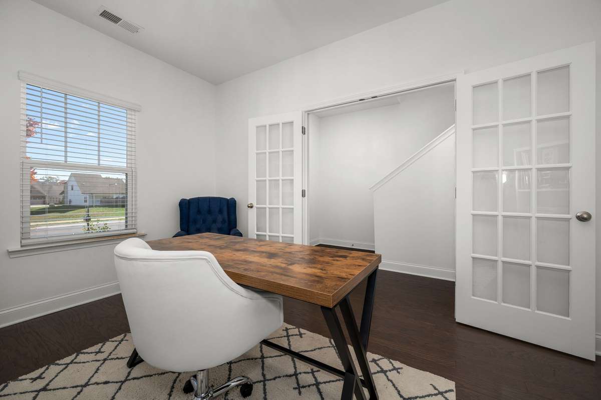 Dedicated office on main level featuring french doors!