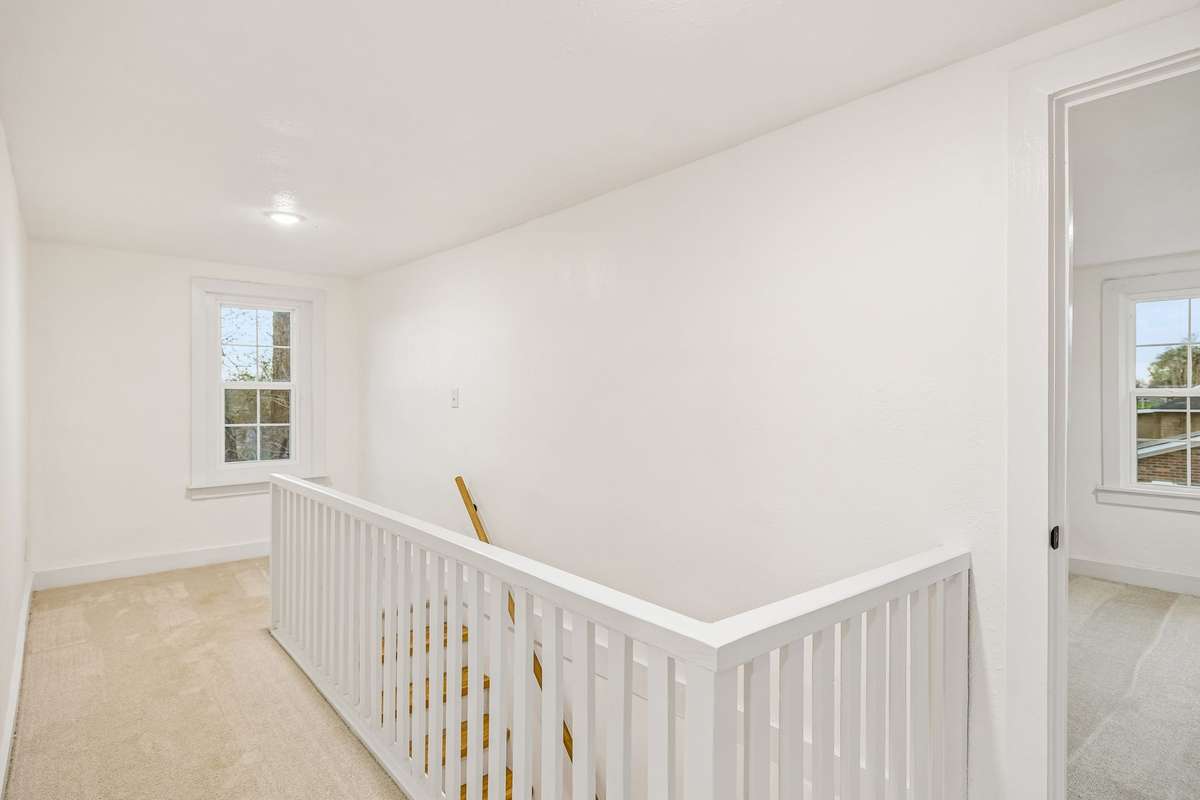 Upstairs features brand new carpet, climate controlled mini split units in each bedroom, and an extra office/flex space