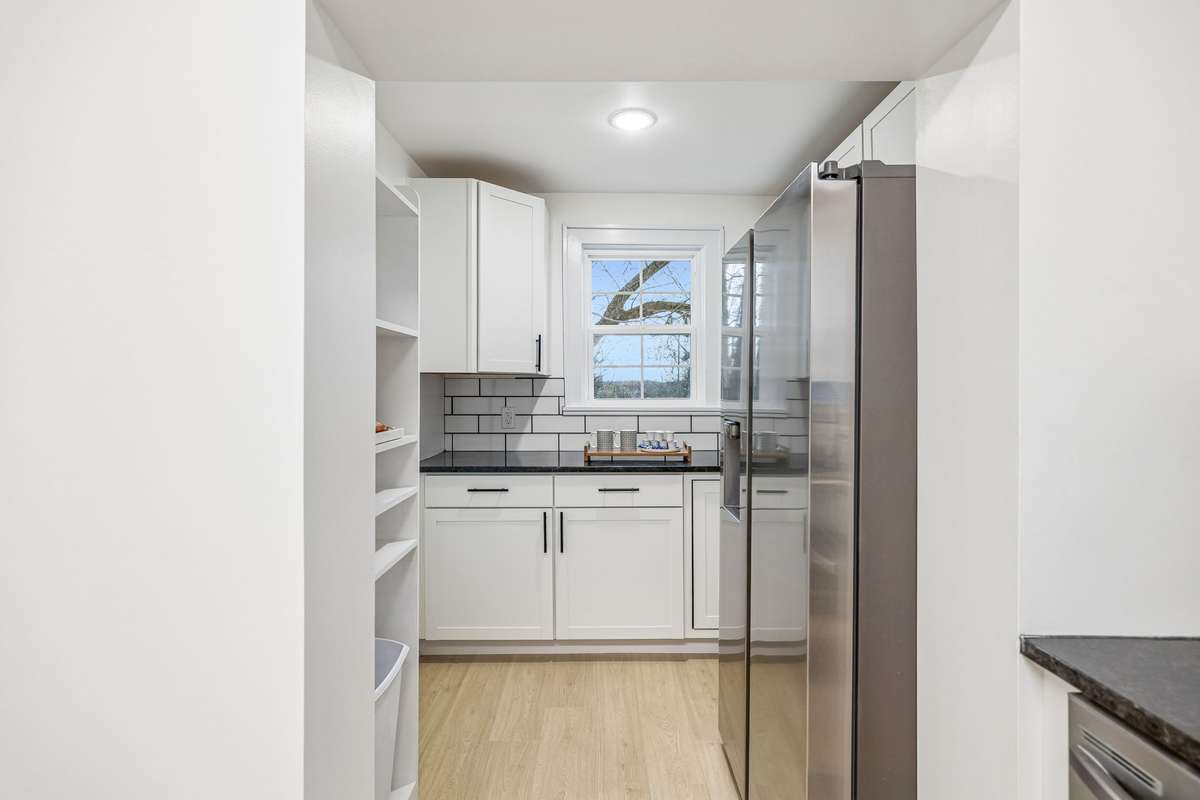 Pantry area with extra storage and brand new refigerator!
