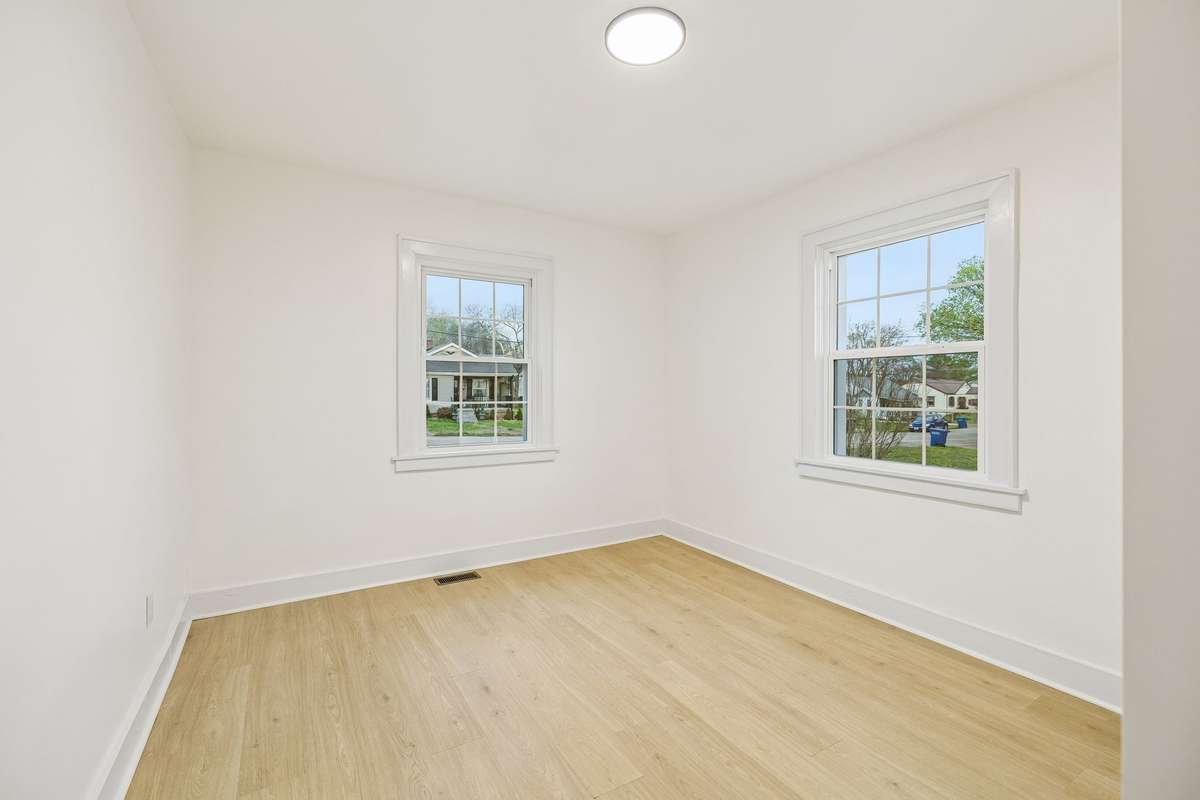 Second bedroom on main level with new flooring, lighting and plenty of natural light!