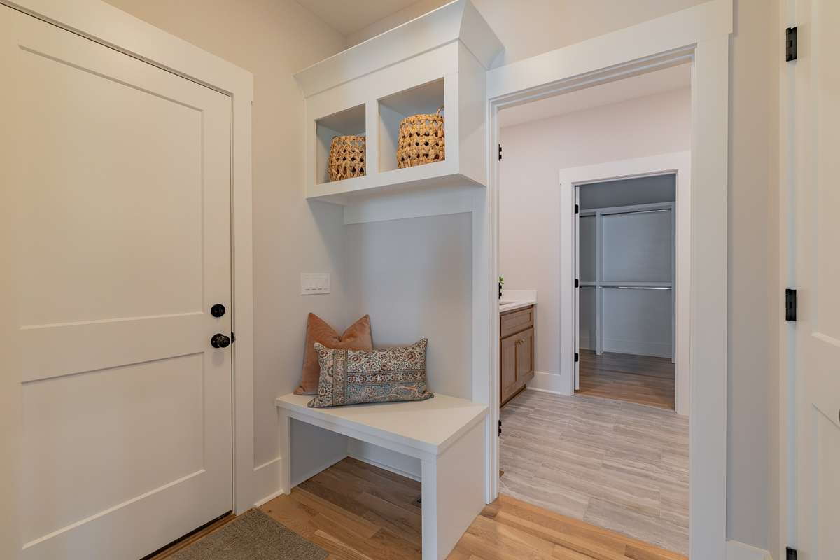 Drop Space off the Garage Door Entrance with the Pantry Door to the Right