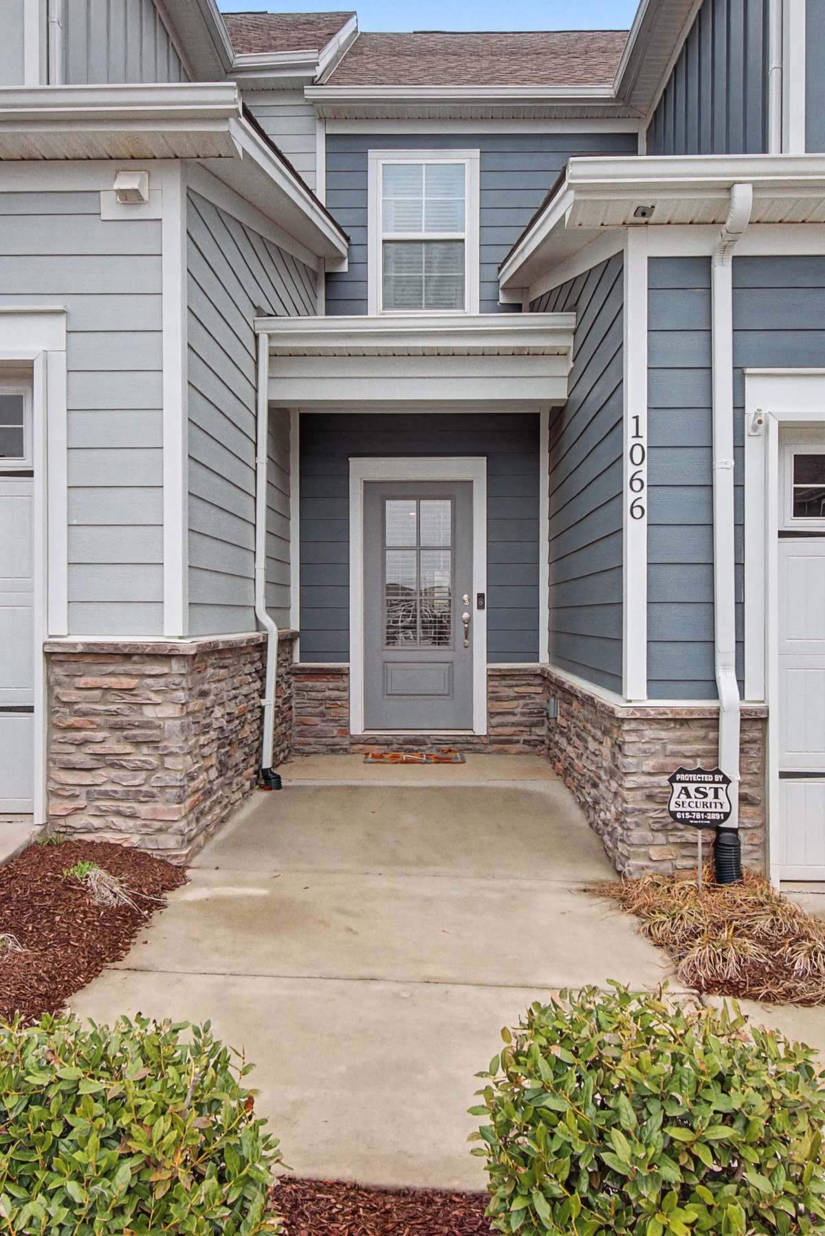 This charming home features an inviting entry with beautiful clapboard and board and batten exterior.