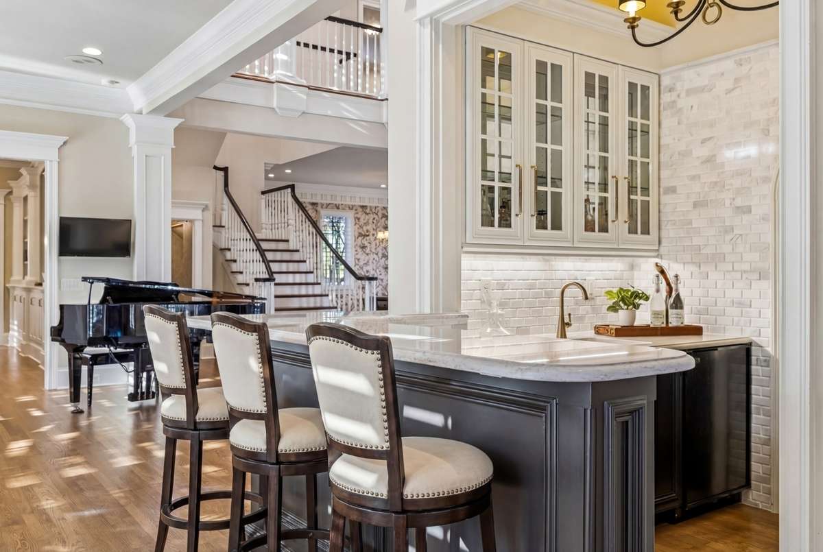 Virtually staged with barstools to illustrate potential use of space.