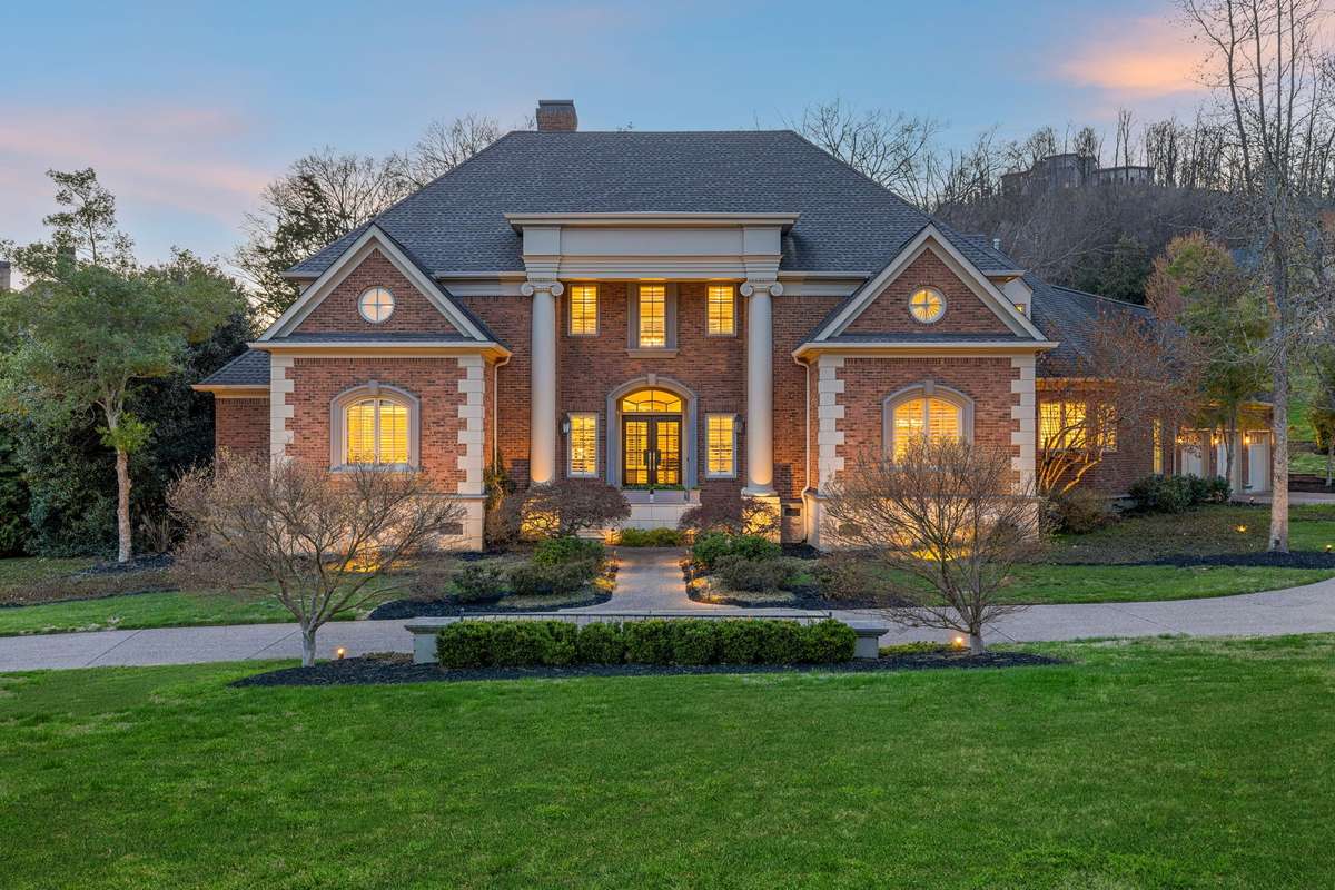 Tucked within the prestigious neighborhood of Legends Ridge, this custom estate blends timeless design with effortless livability, just minutes from the charm of downtown Franklin.