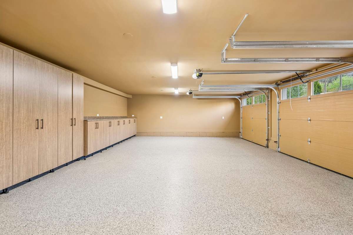 Three-car garage with epoxy floor and plenty of storage
