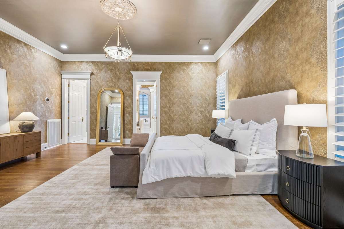 The classic design architecture is accentuated by the house of Scamander, Wallpaper, and Carl Robinson damask from England in the master suite.