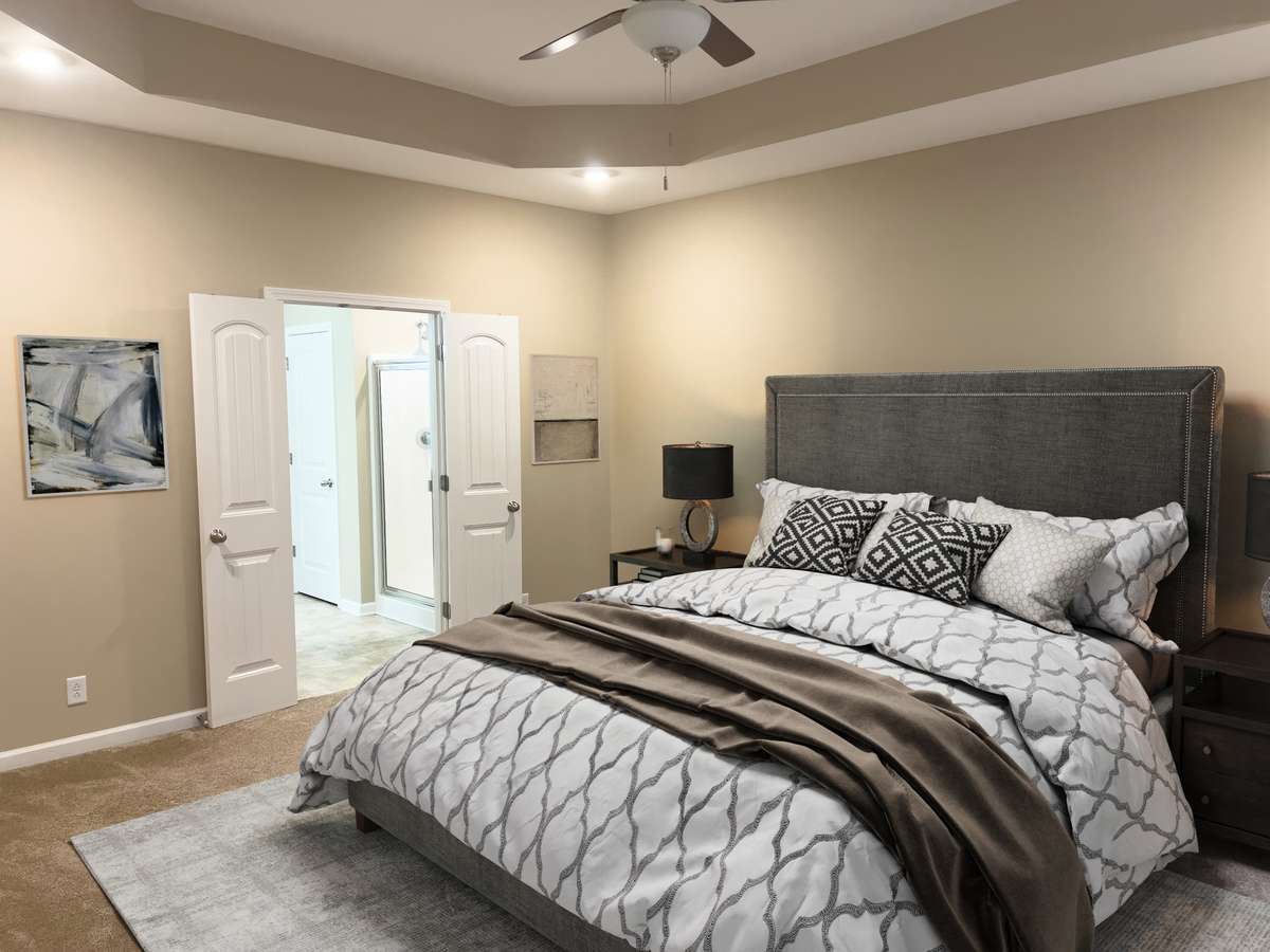 virtually staged primary bedroom - main level