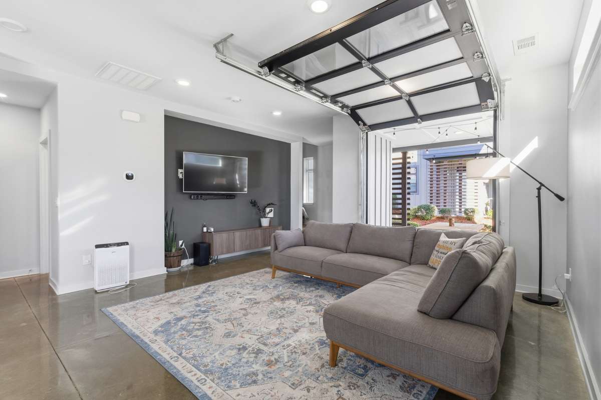 garage door opens up to covered patio for indoor/outdoor living