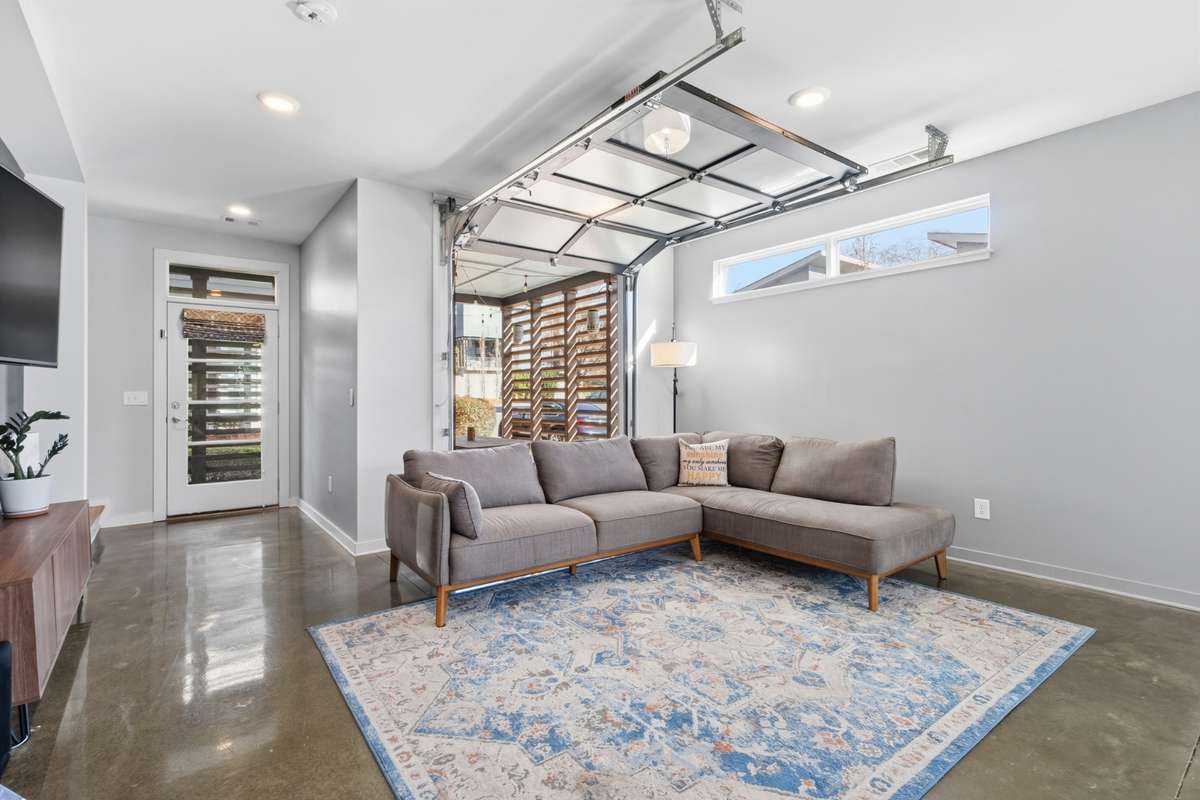 garage door opens up to covered patio for indoor/outdoor living