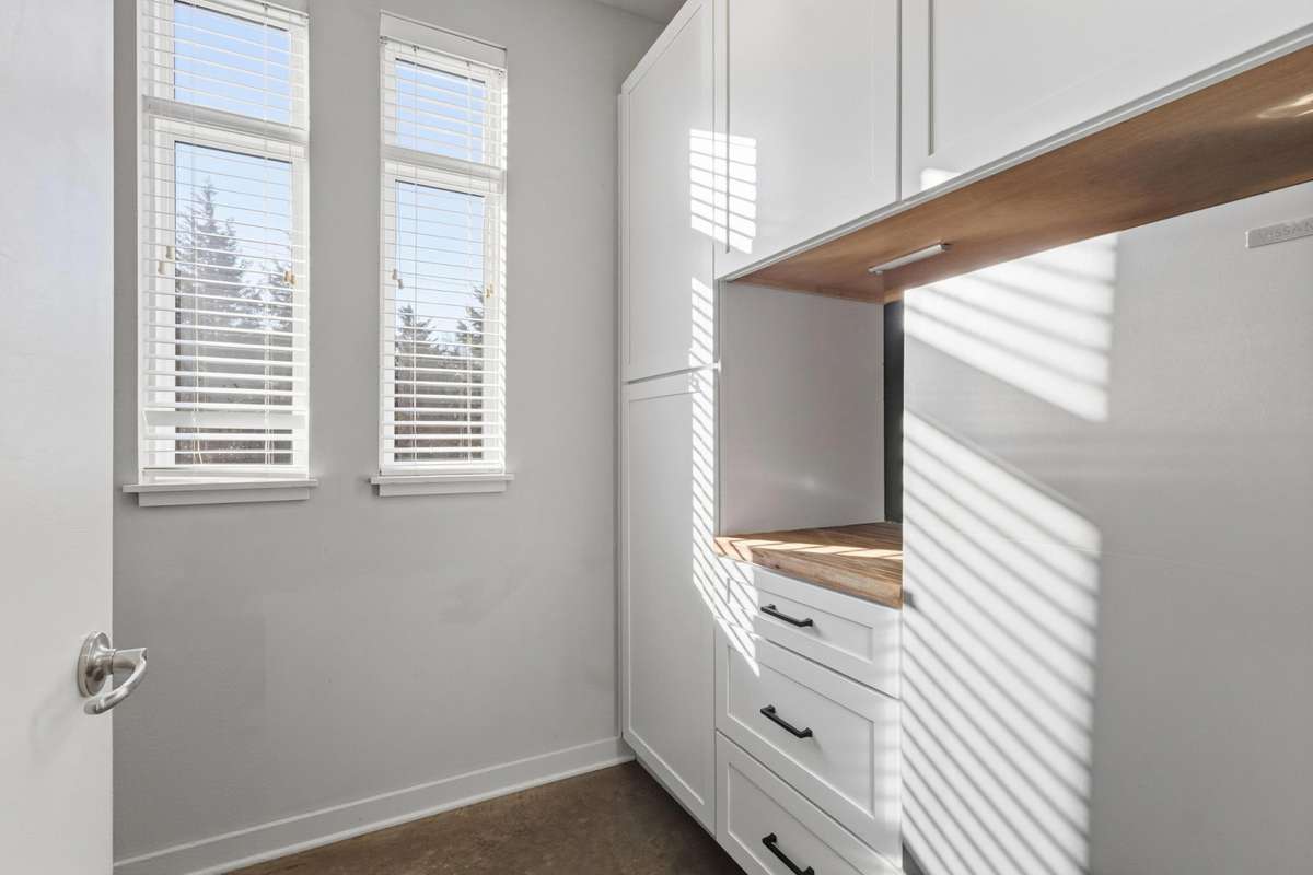 pantry with added cabinetry and freezer