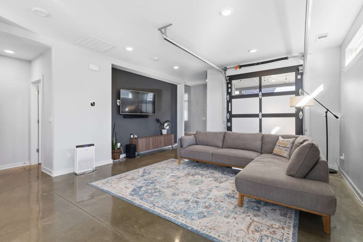 garage door opens up to covered patio for indoor/outdoor living