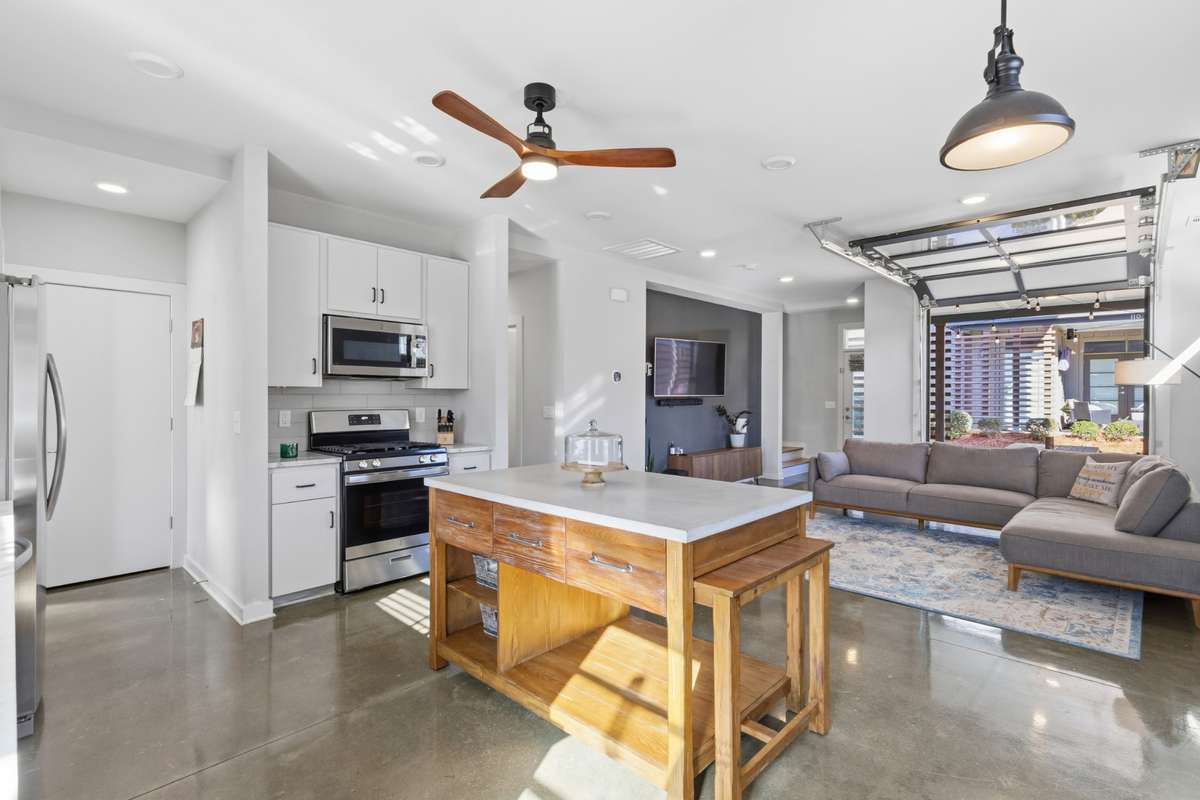 garage door opens up to covered patio for indoor/outdoor living