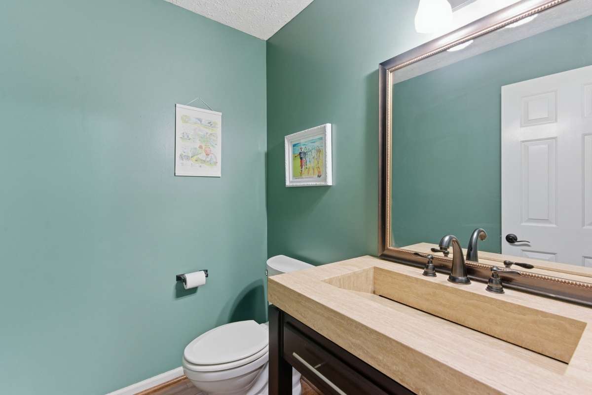 Downstairs half bath in hall.