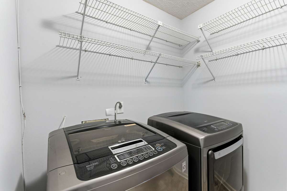 Laundry room in downstairs hallway.