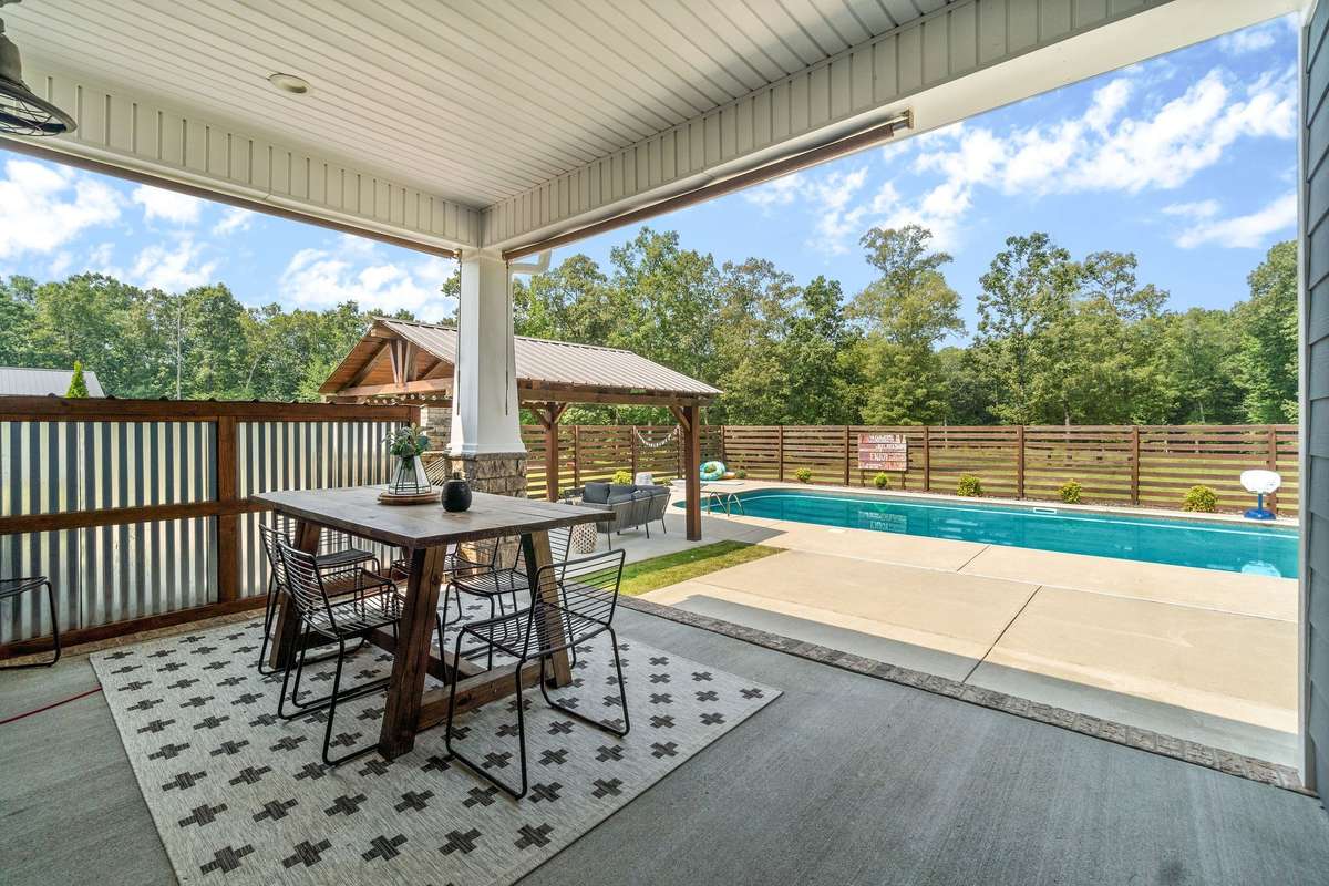 Enjoy a covered back patio, covered pavilion with fireplace, and your saltwater pool