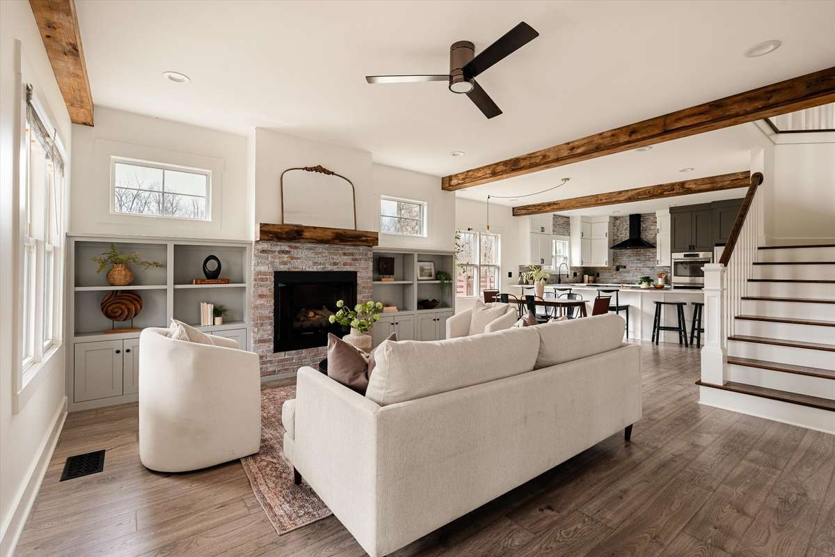 Open concept living highlighted by beautiful wood beams framing the space