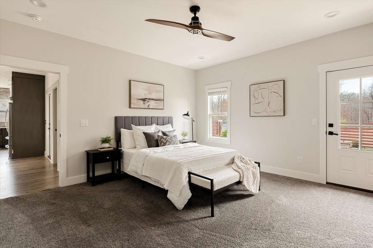 Primary bedroom on main level with access to back yard