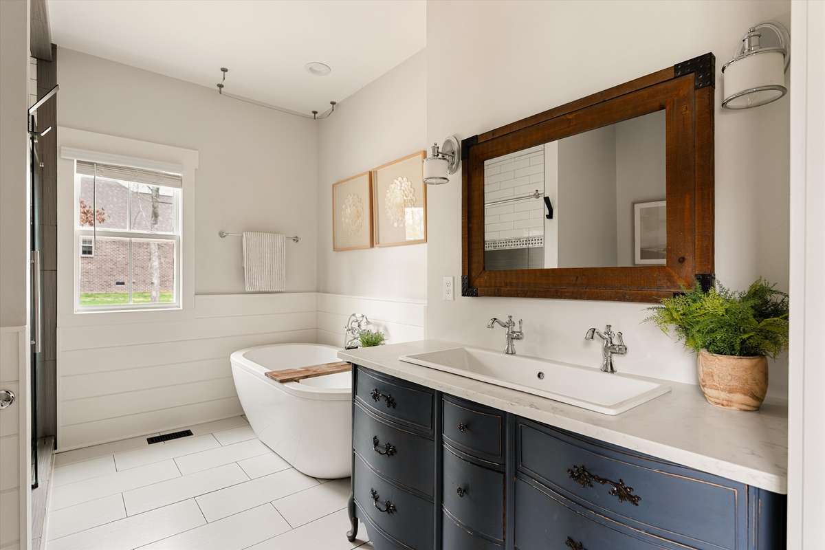 Primary bathroom with soaking tub and standing tile shower
