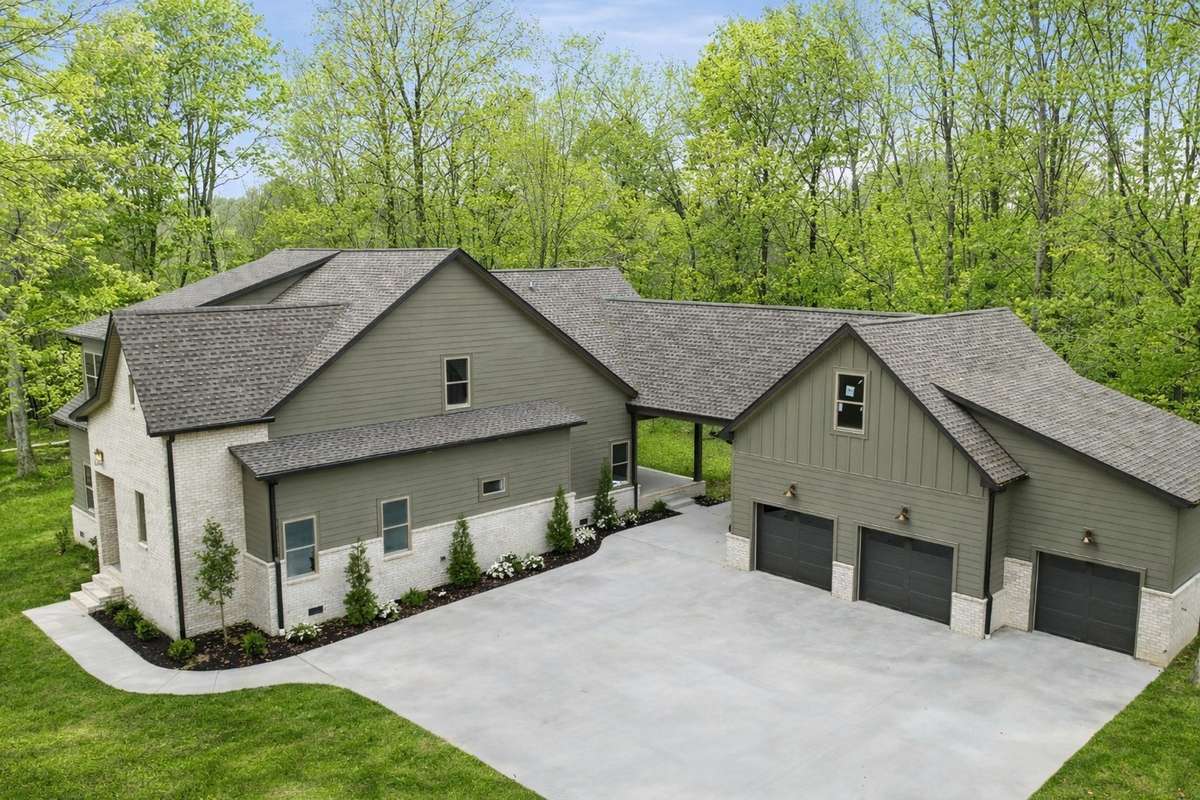 This image has been virtually enhanced to depict the home in a spring setting. Landscaping and foliage may not reflect current conditions.